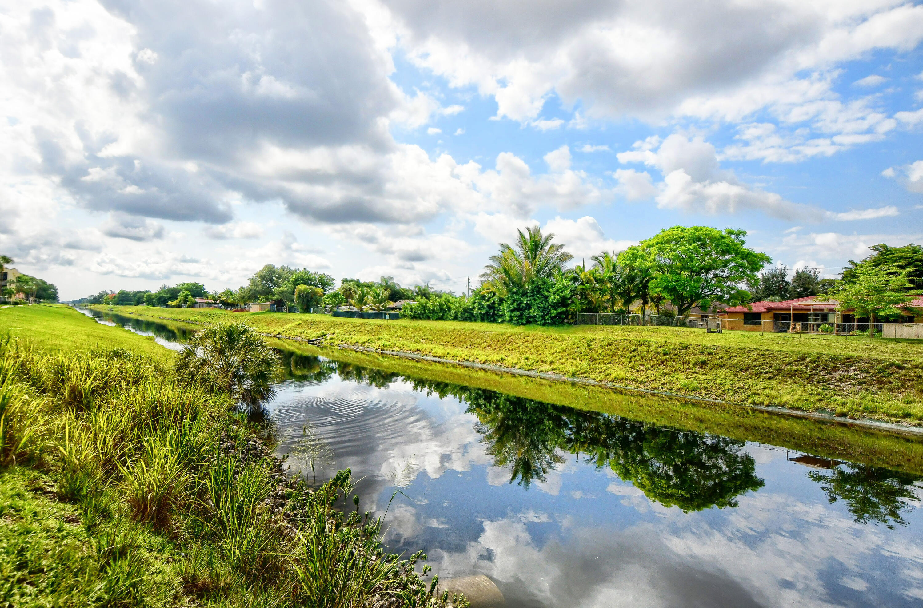 9826 Marina Boulevard, Unit 1027 Boca Raton, FL 33428 - Photo 22 of 25 a view of a lake with a big yard
