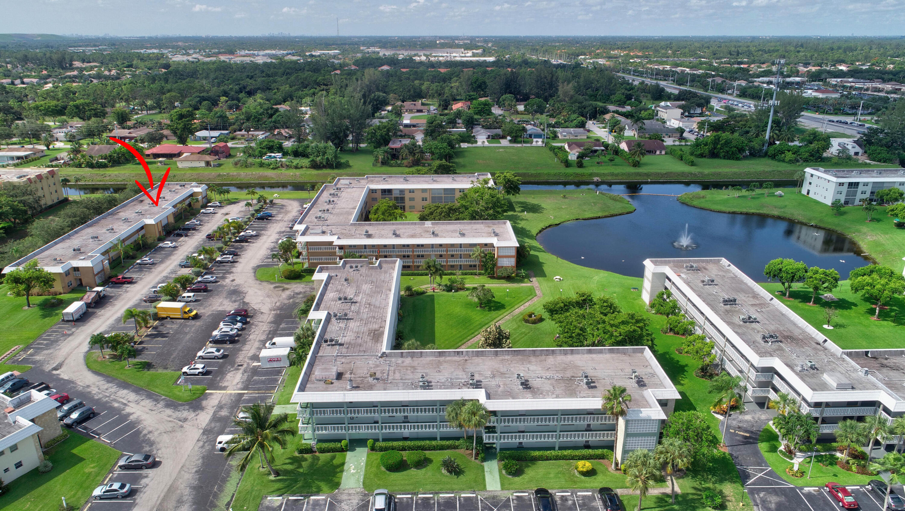 9826 Marina Boulevard, Unit 1027 Boca Raton, FL 33428 - Photo 24 of 25 an aerial view of multiple houses with yard