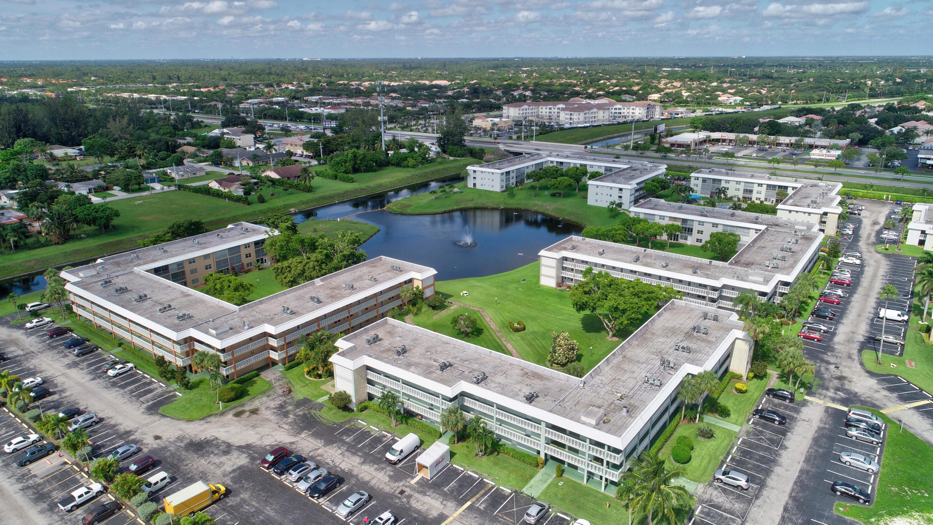 9826 Marina Boulevard, Unit 1027 Boca Raton, FL 33428 - Photo 25 of 25 an aerial view of a house with a garden and lake view
