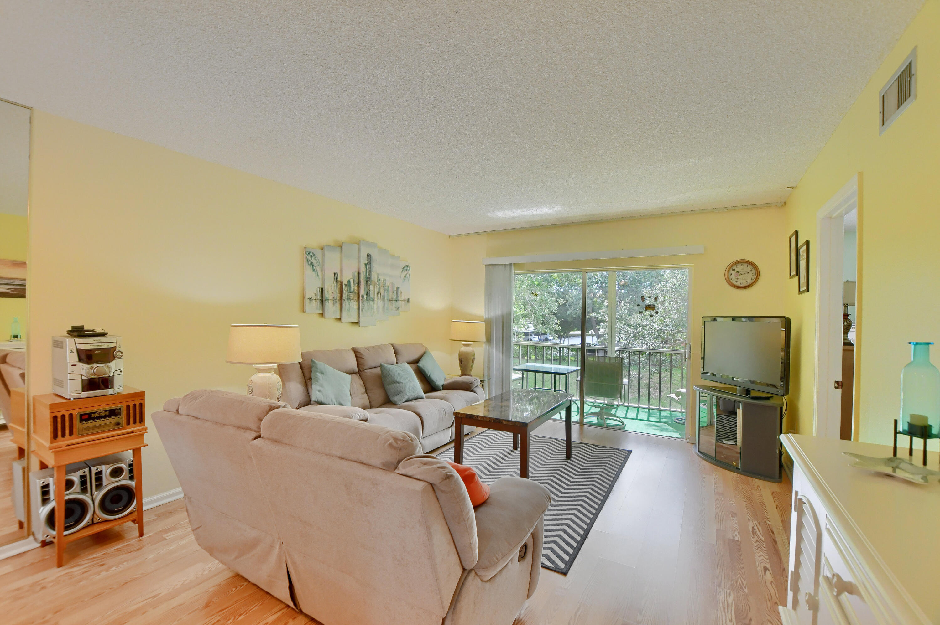 9826 Marina Boulevard, Unit 1027 Boca Raton, FL 33428 - Photo 7 of 25 a living room with furniture and a large window