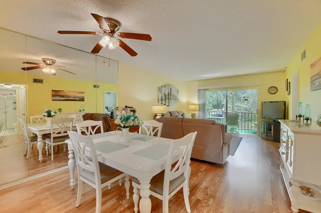 a view of a dining room with furniture window and outside view