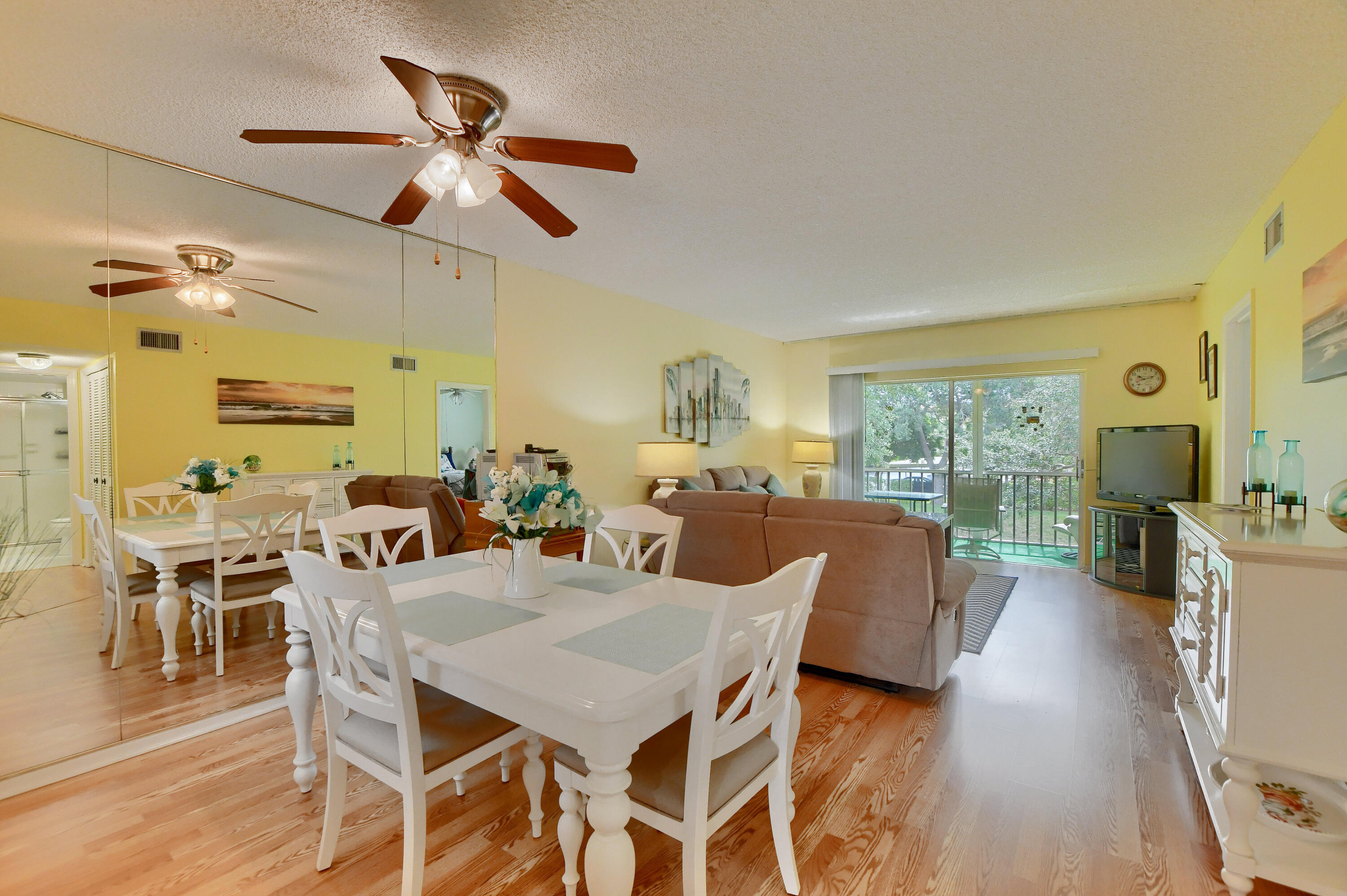 9826 Marina Boulevard, Unit 1027 Boca Raton, FL 33428 - Photo 8 of 25 a view of a dining room with furniture window and outside view