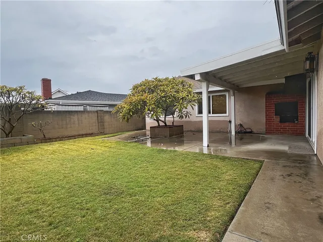 a swimming pool with outdoor seating and yard
