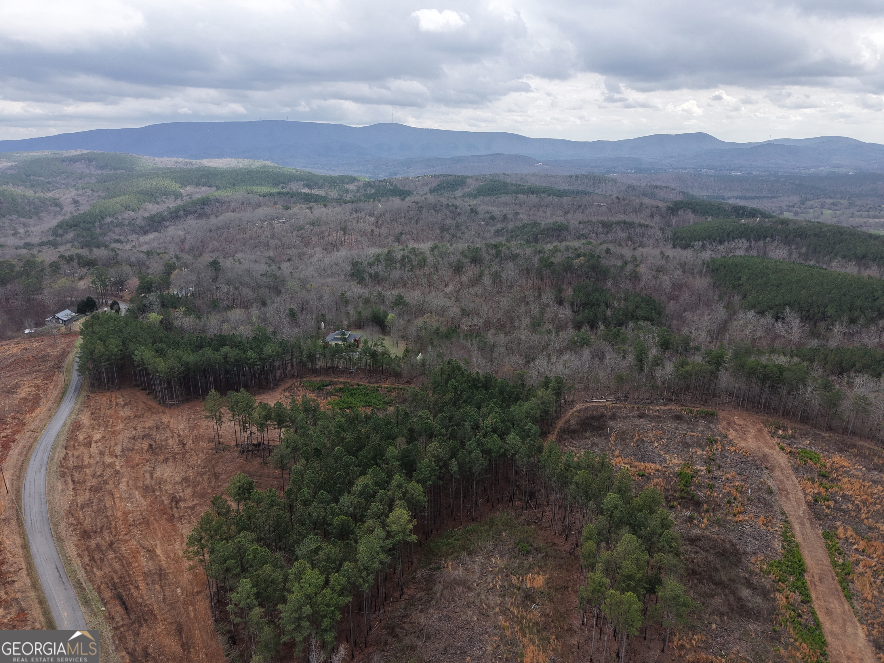 0 Johnson Mountain Road, Unit 7401I Fairmount, GA 30139 - Photo 64 of 76 a view of a town with mountains in the background