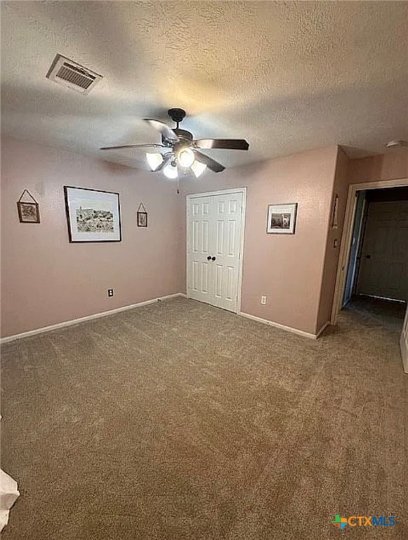 809 Buttercup Drive Edna, TX 77957 - Photo 11 of 16 a view of an empty room with a ceiling fan