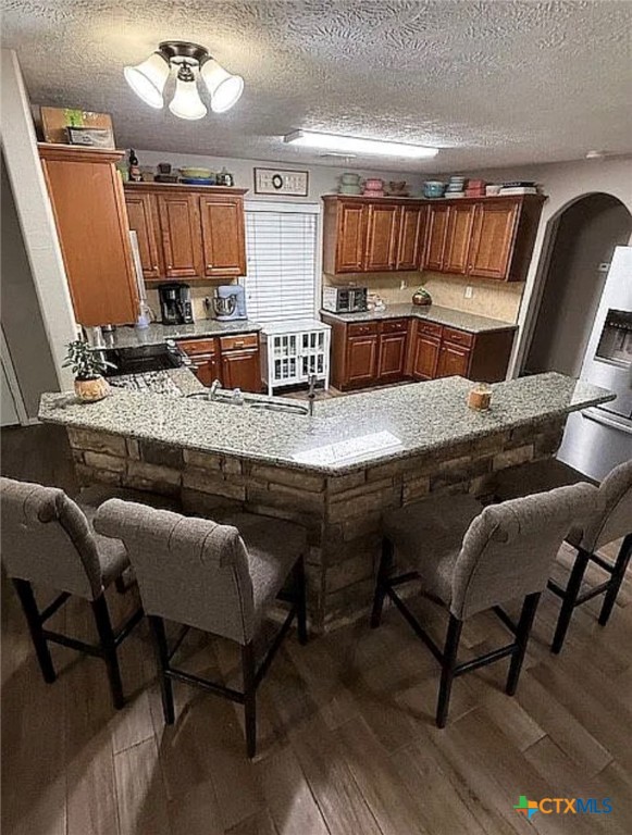 809 Buttercup Drive Edna, TX 77957 - Photo 13 of 16 a kitchen with kitchen island granite countertop wooden cabinets and counter space
