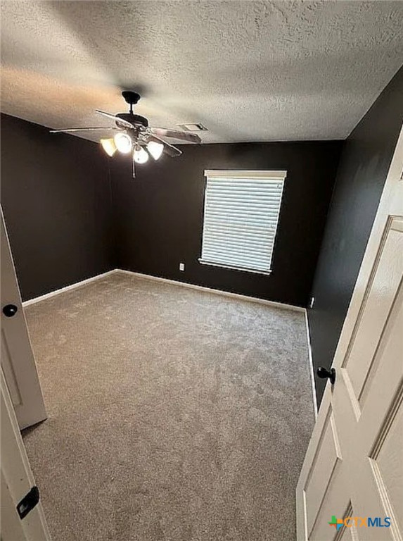 809 Buttercup Drive Edna, TX 77957 - Photo 16 of 16 a view of a big room with windows and chandelier fan