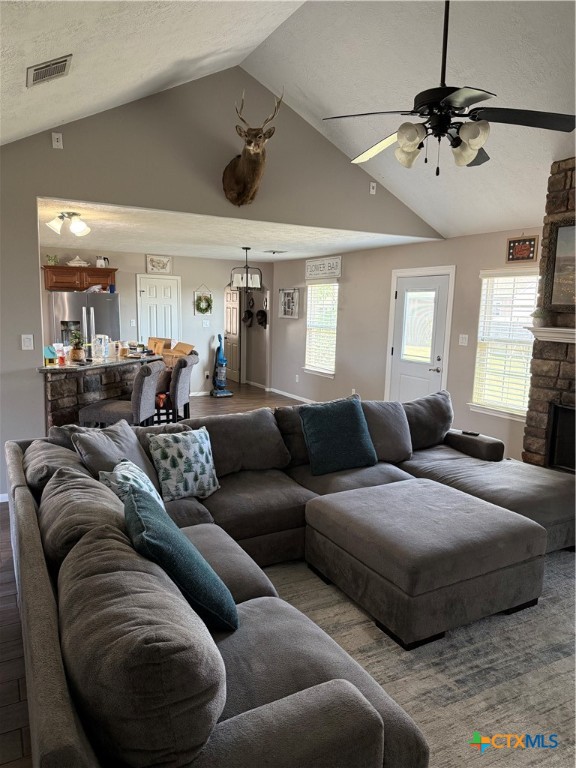809 Buttercup Drive Edna, TX 77957 - Photo 4 of 16 a living room with furniture and a chandelier