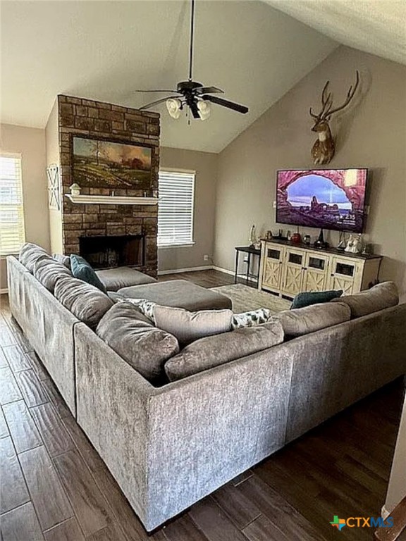 809 Buttercup Drive Edna, TX 77957 - Photo 6 of 16 a living room with furniture a fireplace and a flat screen tv
