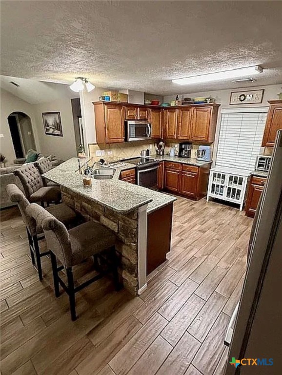 809 Buttercup Drive Edna, TX 77957 - Photo 8 of 16 a living room with lots of furniture and kitchen view