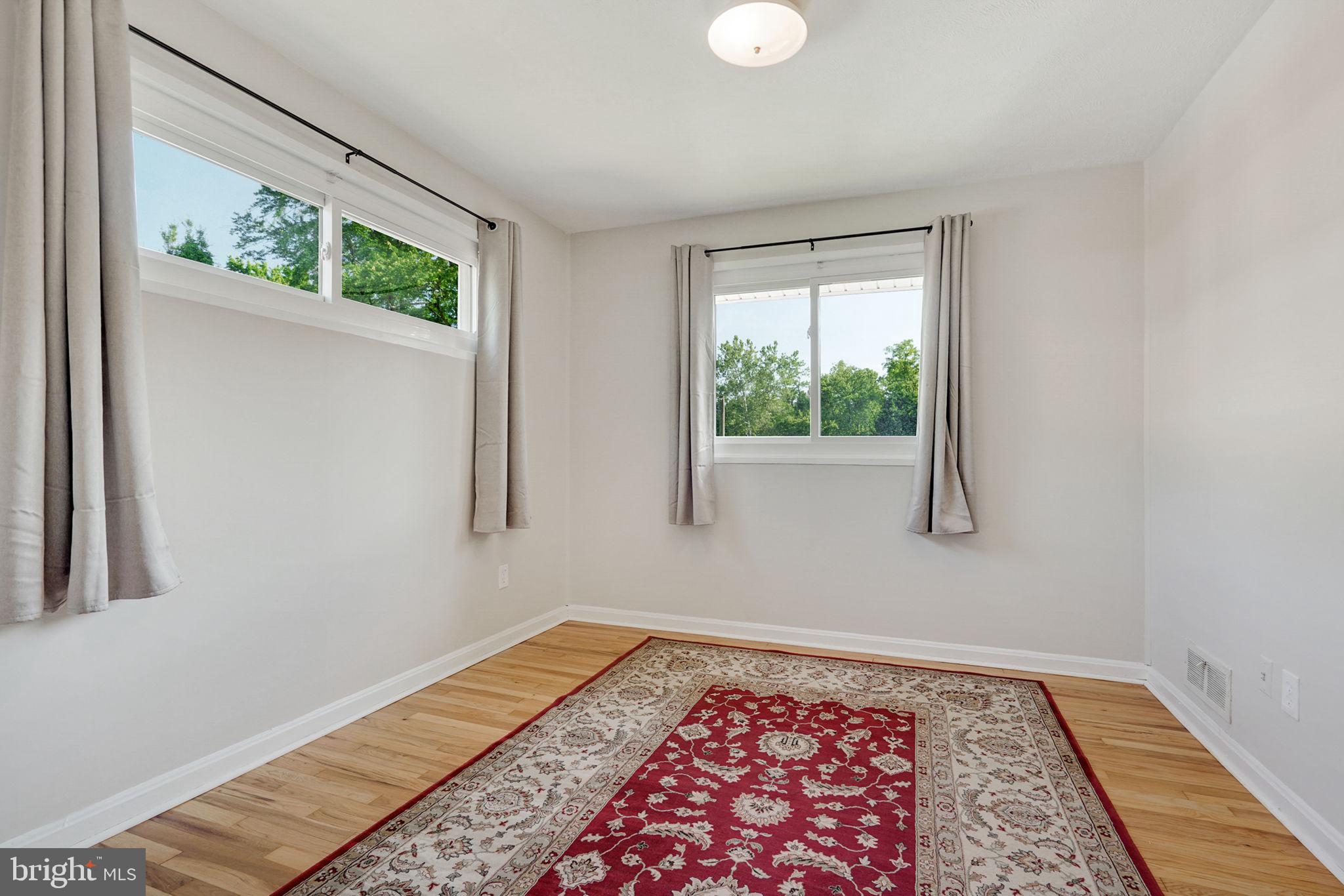6369 Edsall Road Alexandria, VA 22312 - Photo 12 of 33 a bed sitting in a bedroom next to a window
