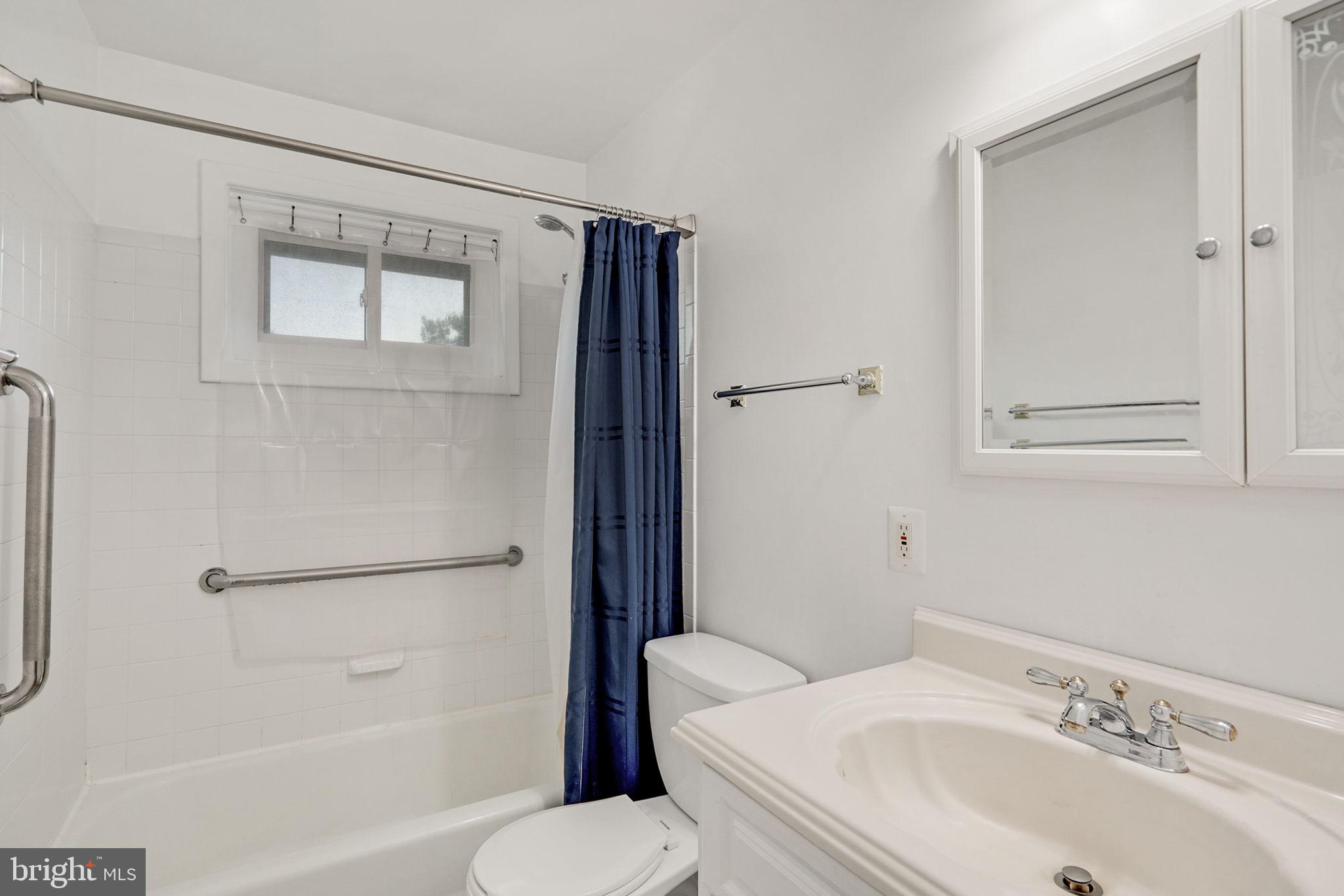 6369 Edsall Road Alexandria, VA 22312 - Photo 14 of 33 a bathroom with a sink toilet and shower