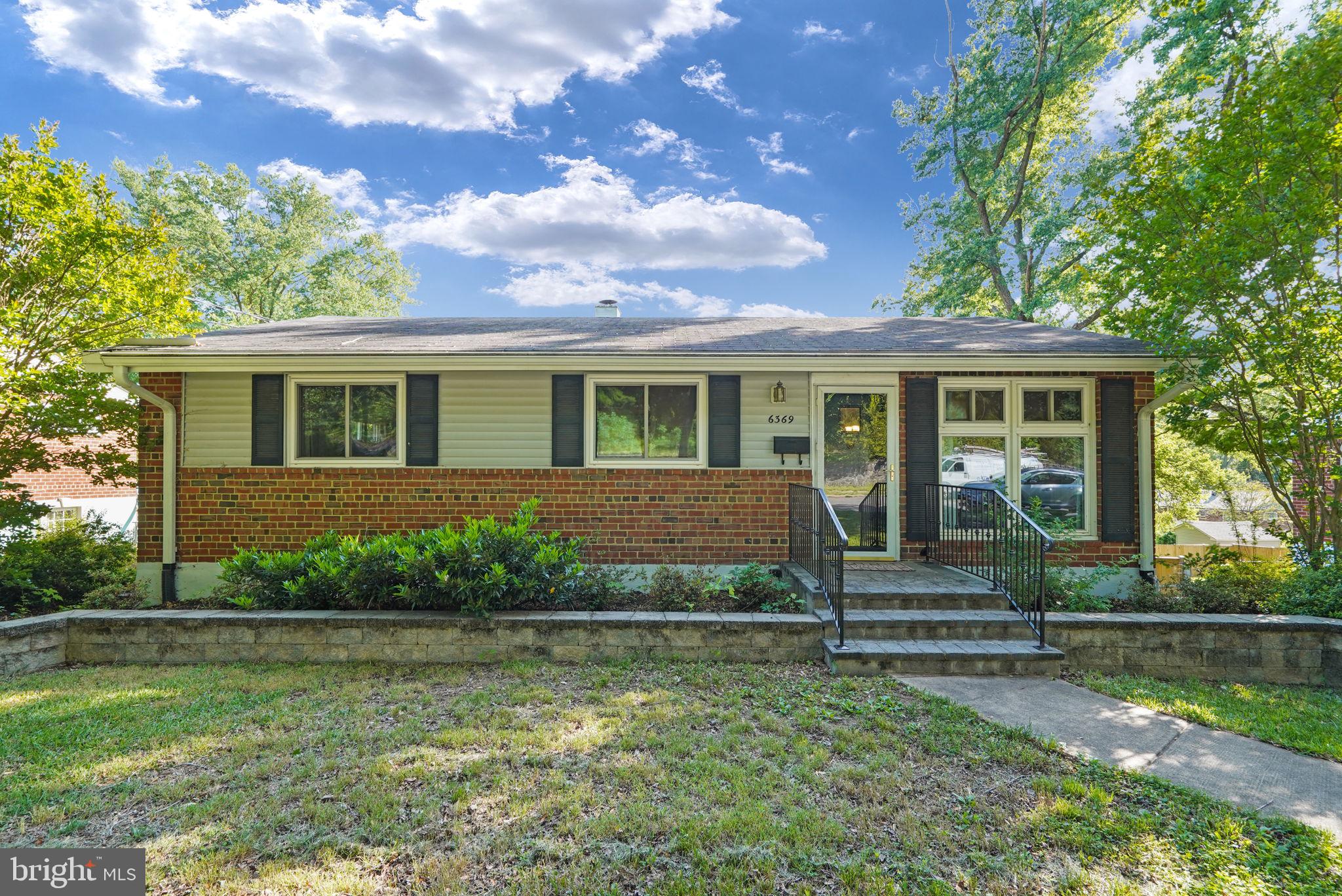 6369 Edsall Road Alexandria, VA 22312 - Photo 2 of 33 a front view of a house with a yard