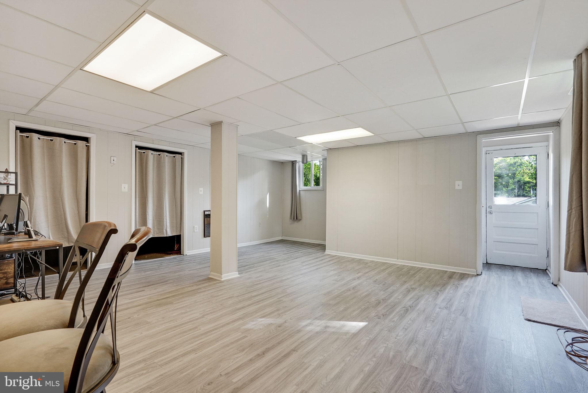 6369 Edsall Road Alexandria, VA 22312 - Photo 24 of 33 an empty room with wooden floor and windows