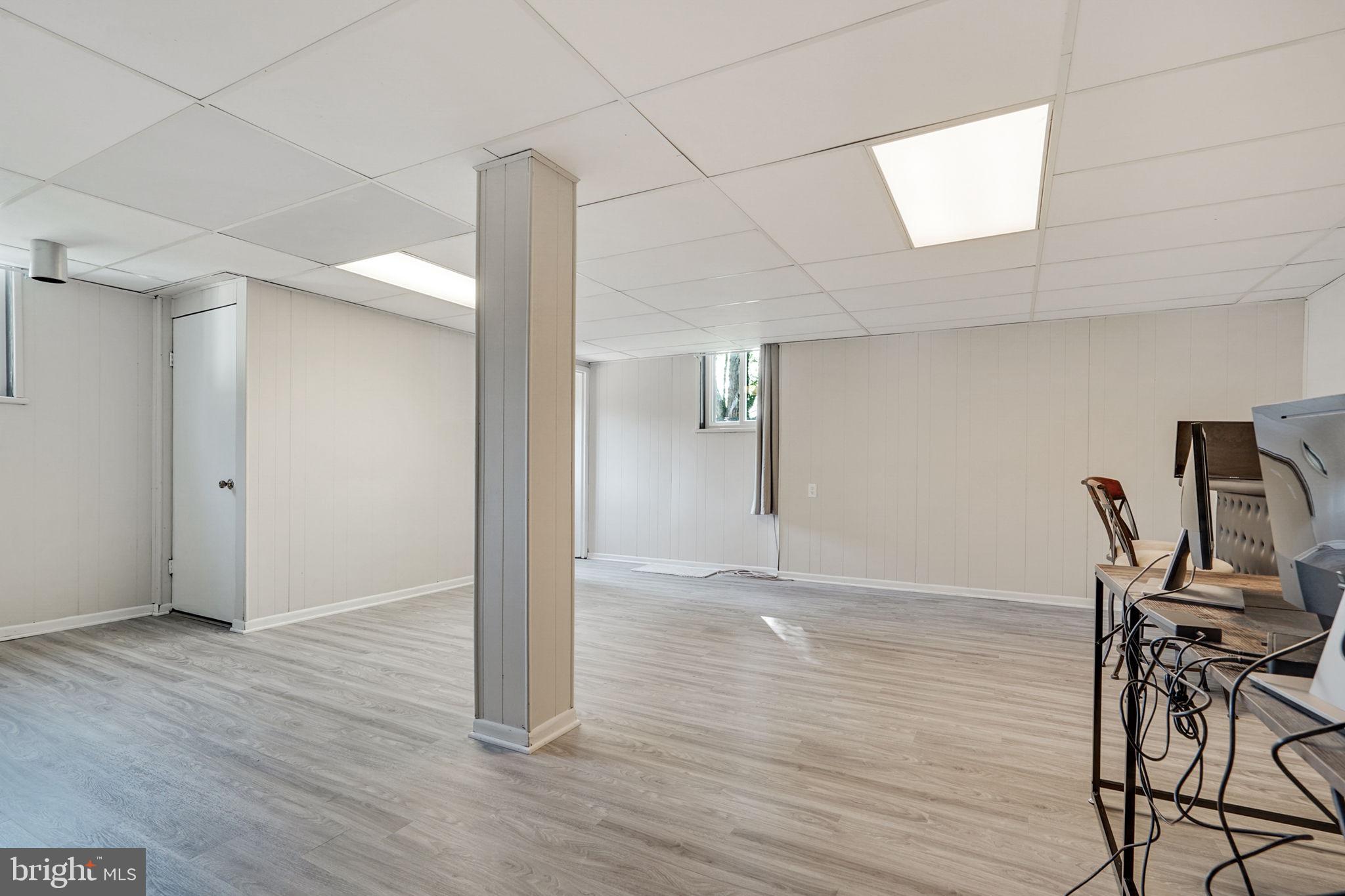 6369 Edsall Road Alexandria, VA 22312 - Photo 26 of 33 a view of a room with wooden floor lounge chair and windows