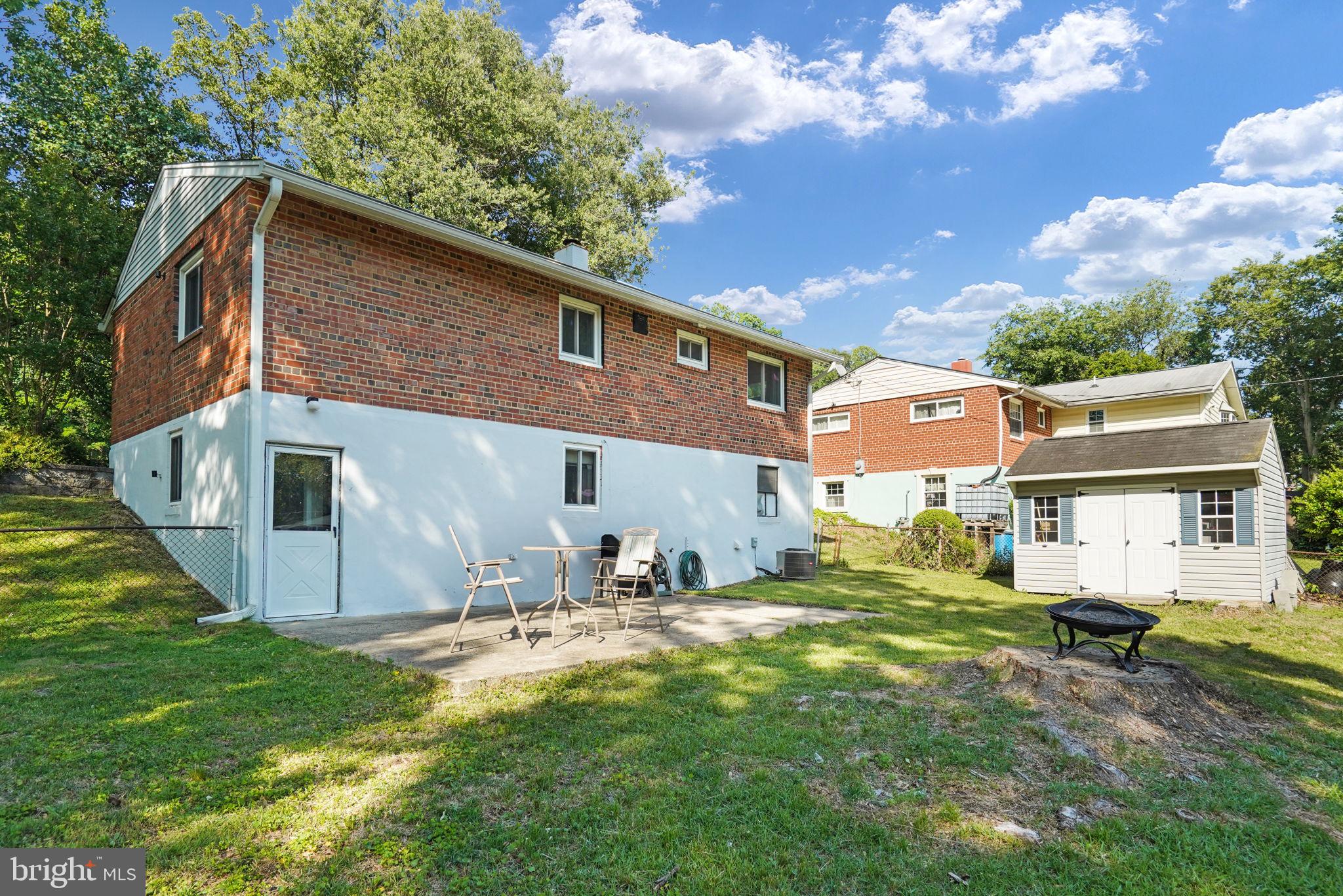 6369 Edsall Road Alexandria, VA 22312 - Photo 28 of 33 a backyard of a house with table and chairs