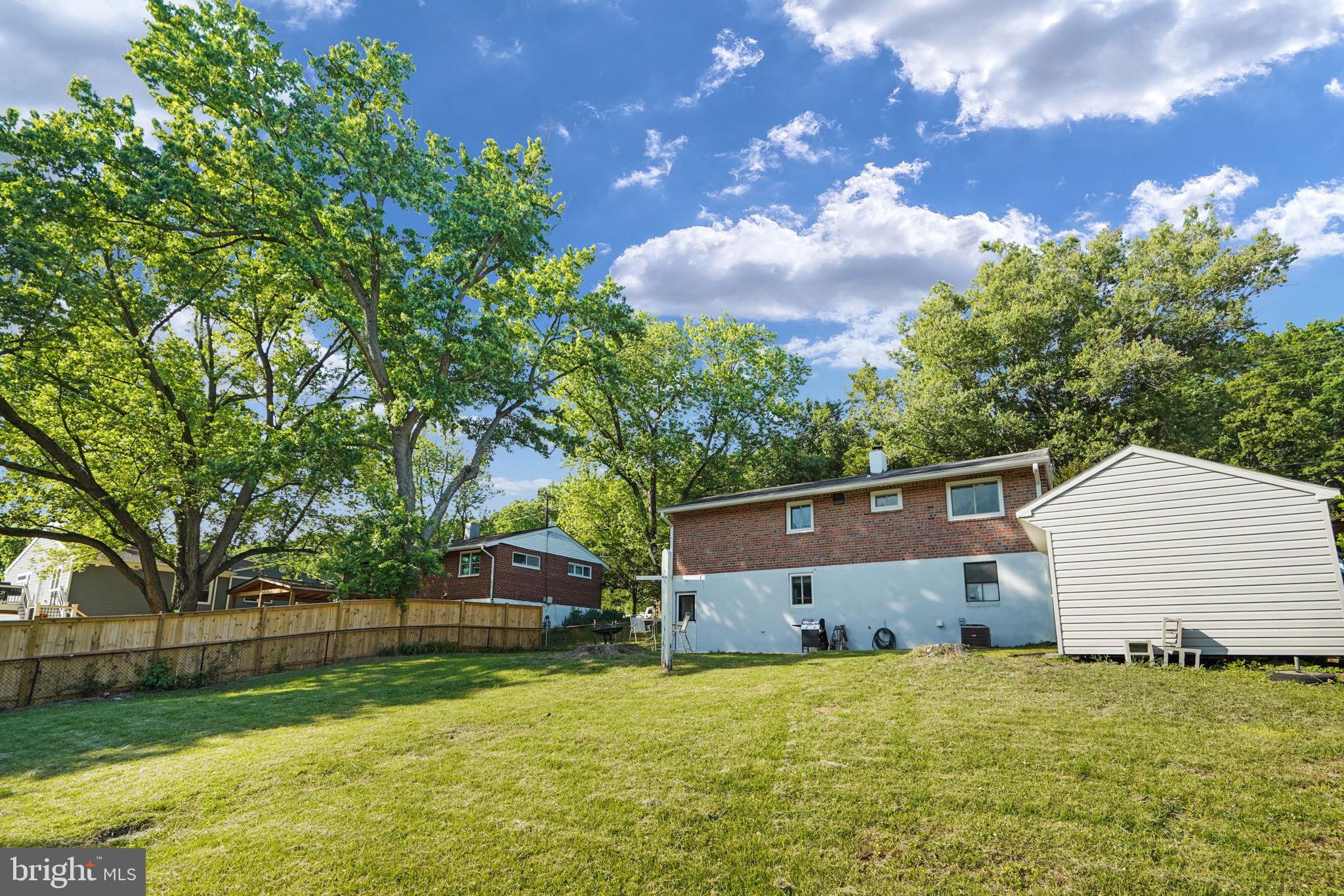 6369 Edsall Road Alexandria, VA 22312 - Photo 30 of 33 a front view of a house with a yard and garage