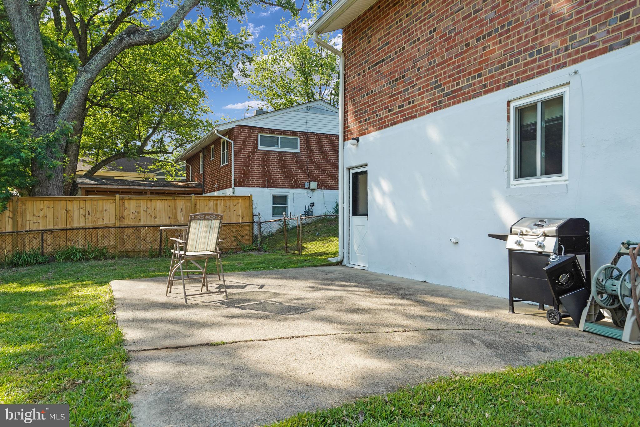 6369 Edsall Road Alexandria, VA 22312 - Photo 32 of 33 a front view of a house with garden