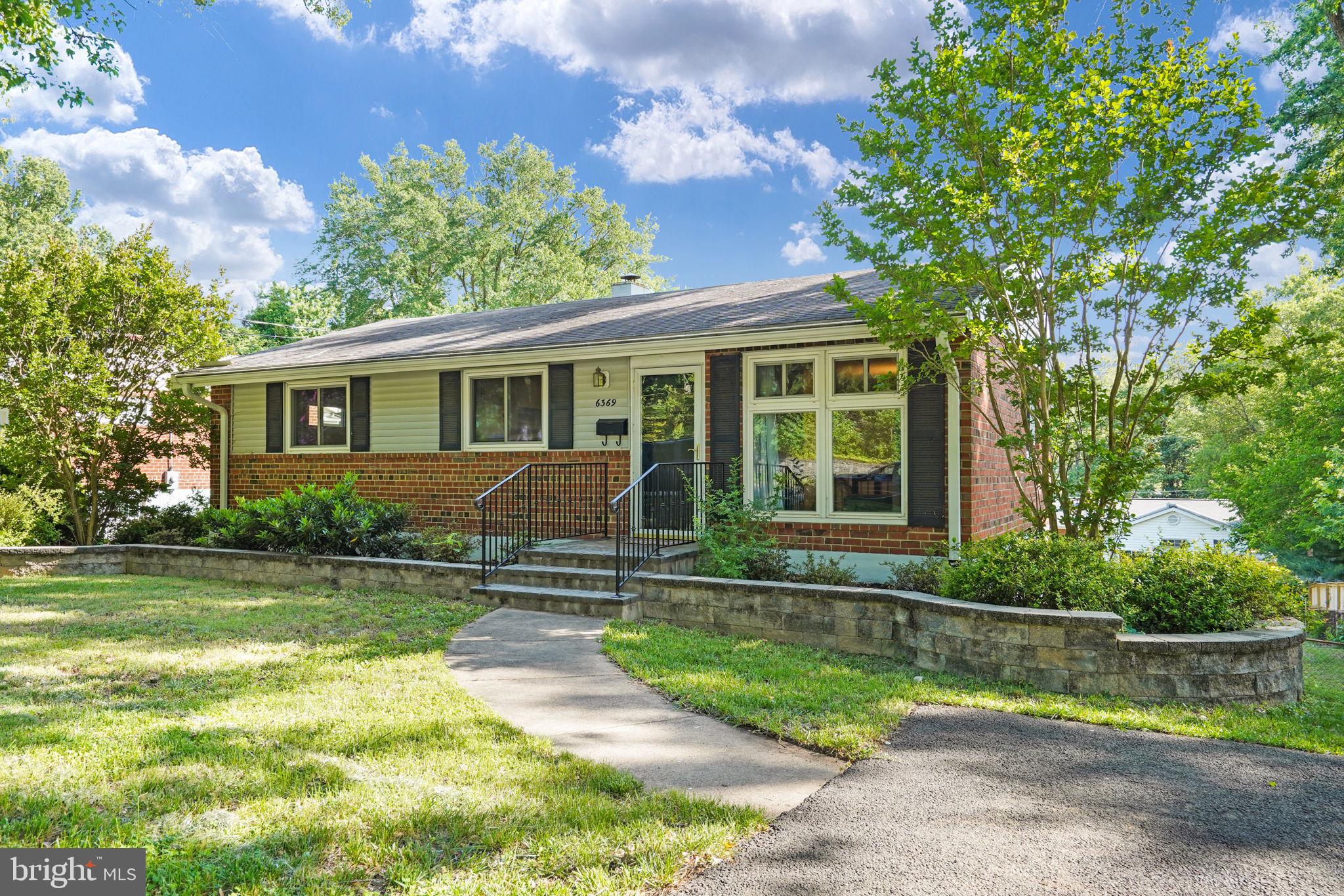 6369 Edsall Road Alexandria, VA 22312 - Photo 5 of 33 a front view of a house with a yard