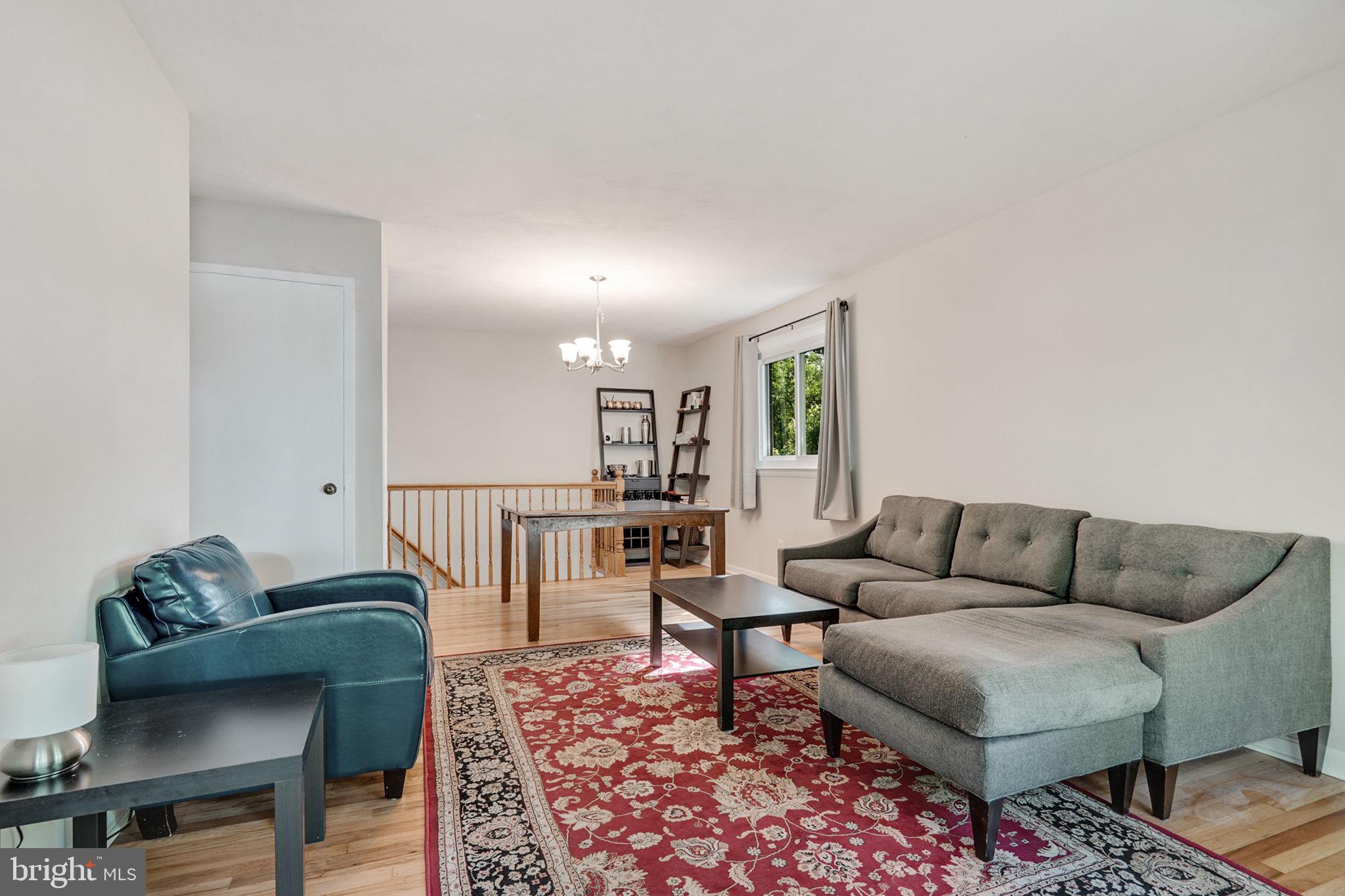 6369 Edsall Road Alexandria, VA 22312 - Photo 6 of 33 a living room with furniture and a rug