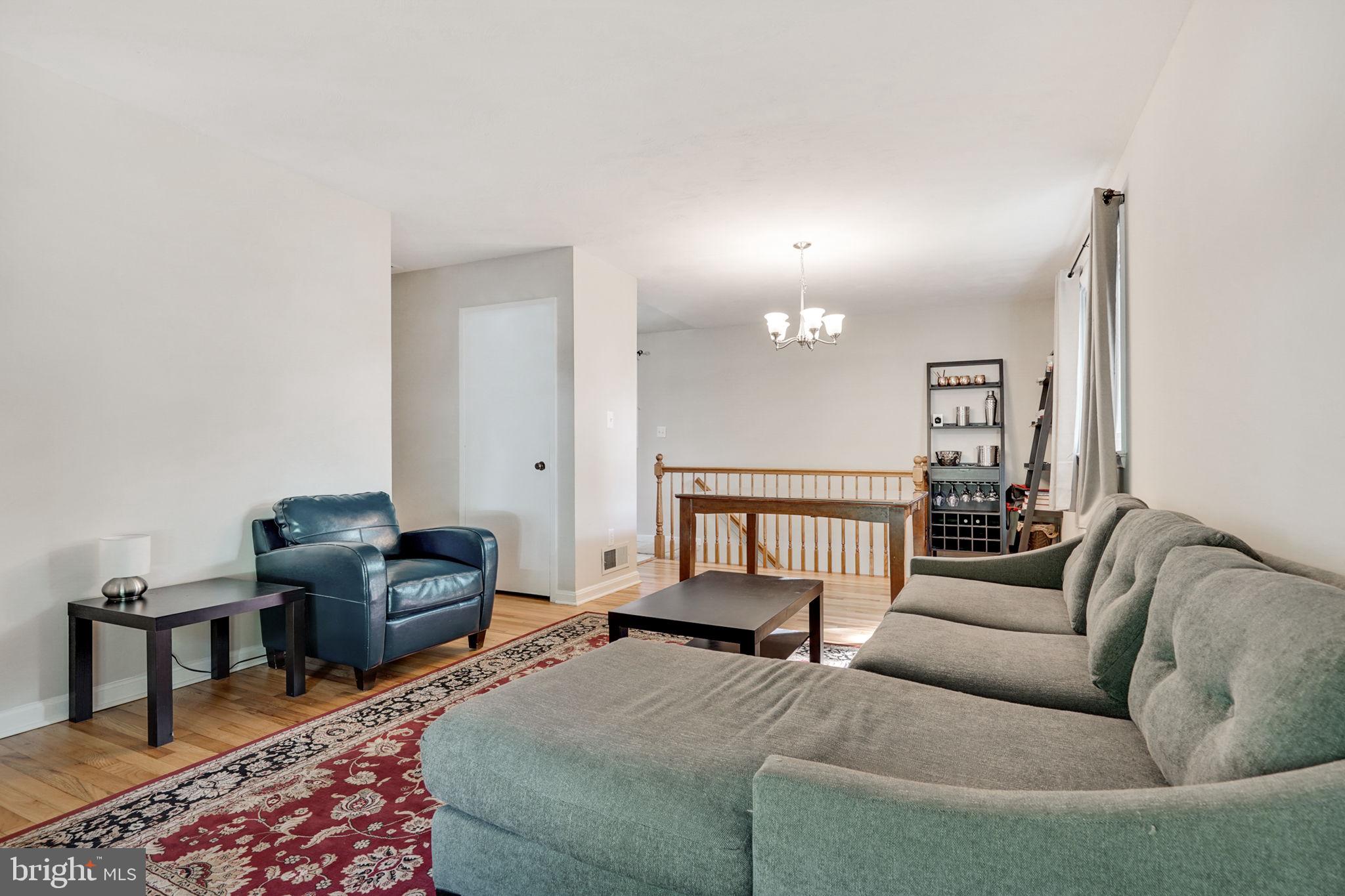 6369 Edsall Road Alexandria, VA 22312 - Photo 7 of 33 a living room with furniture and a rug