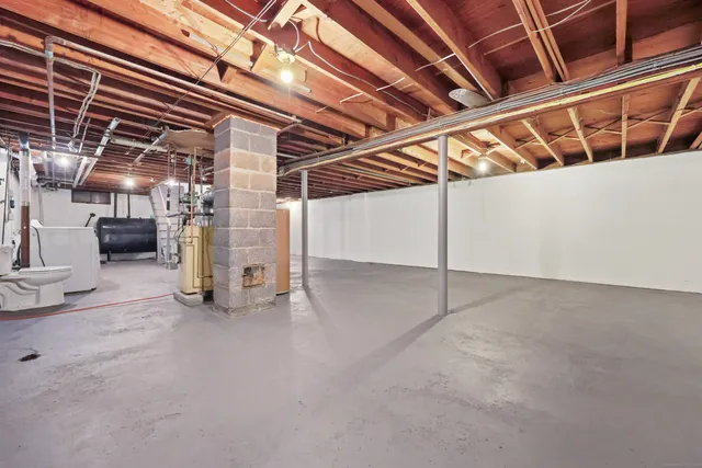 a view of empty room with wooden ceiling
