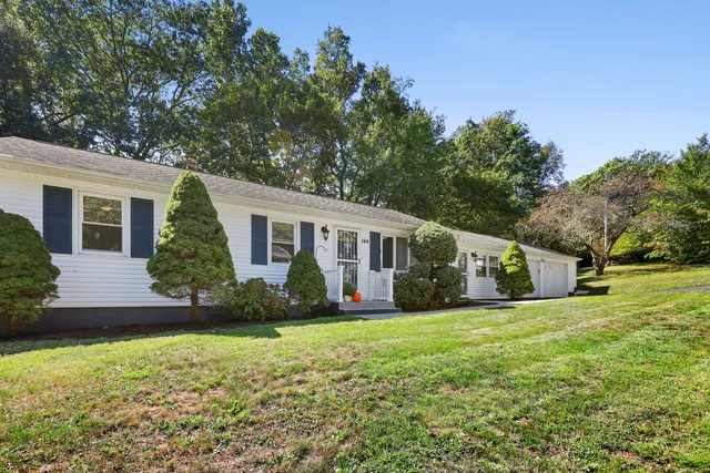 a view of a house with a yard