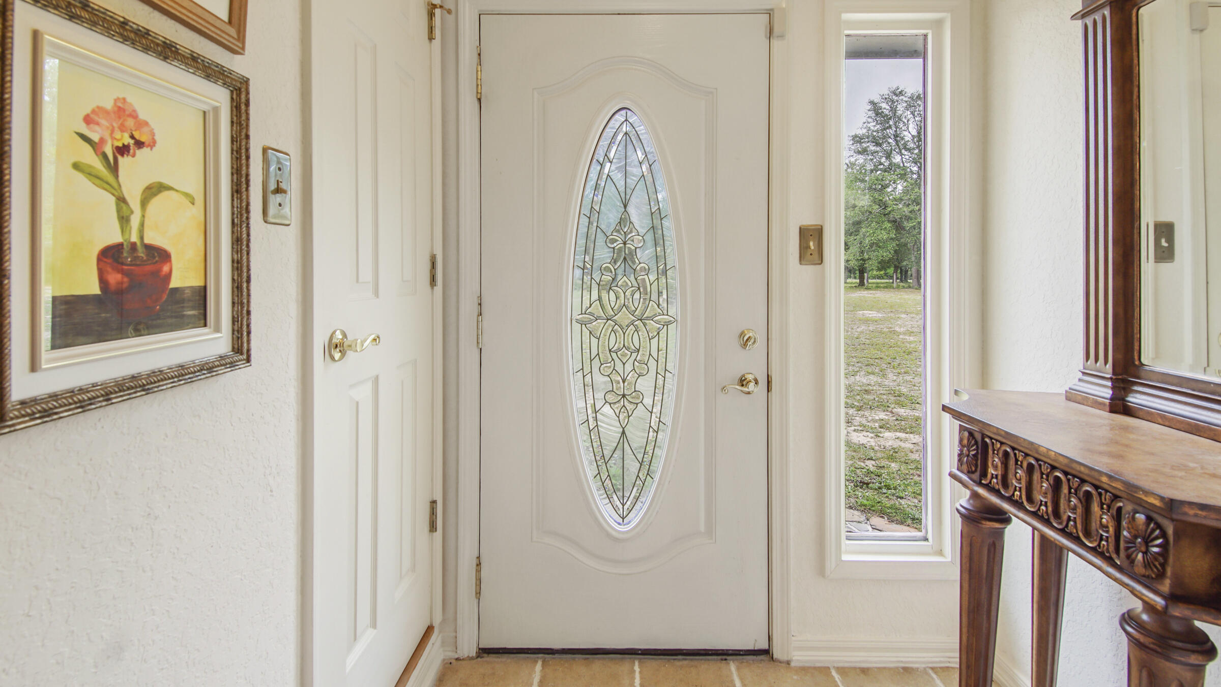 103 Pretty Pond Lane DeFuniak Springs, FL 32433 - Photo 39 of 45 FRONT DOOR STAINED GLASS