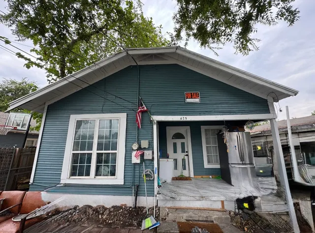 a front view of a house with glass windows