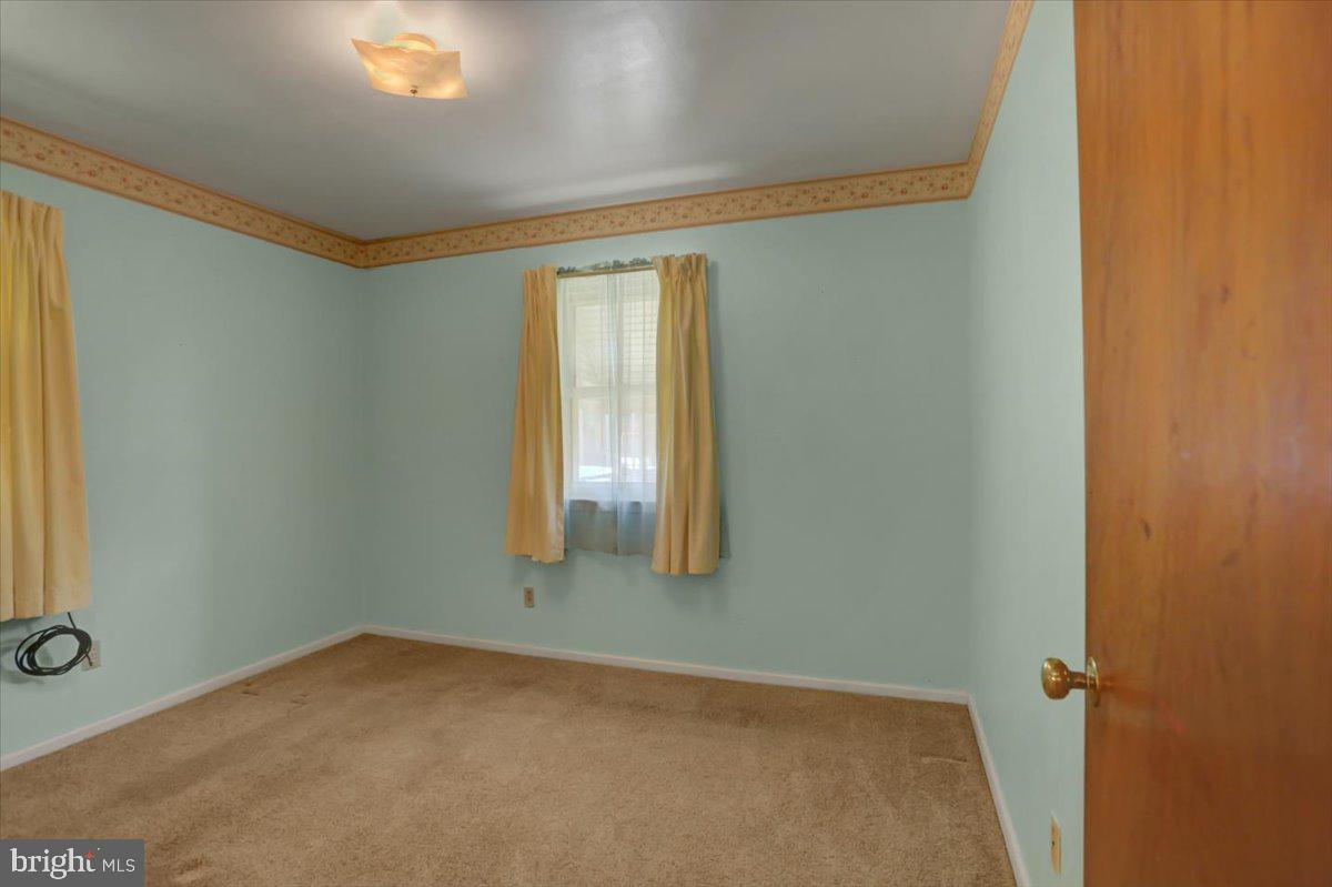 907 Cherokee Trail Frederick, MD 21701 - Photo 14 of 34 an empty room with windows