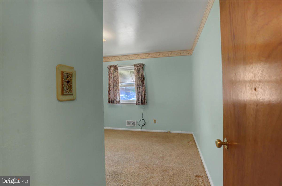 907 Cherokee Trail Frederick, MD 21701 - Photo 18 of 34 a bathroom with a sink and mirror