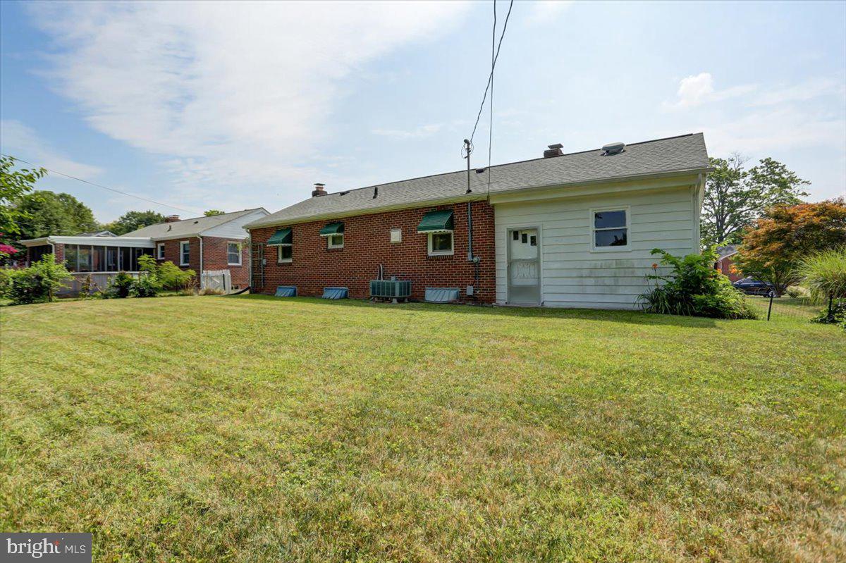 907 Cherokee Trail Frederick, MD 21701 - Photo 29 of 34 a front view of house with yard and trees in the background