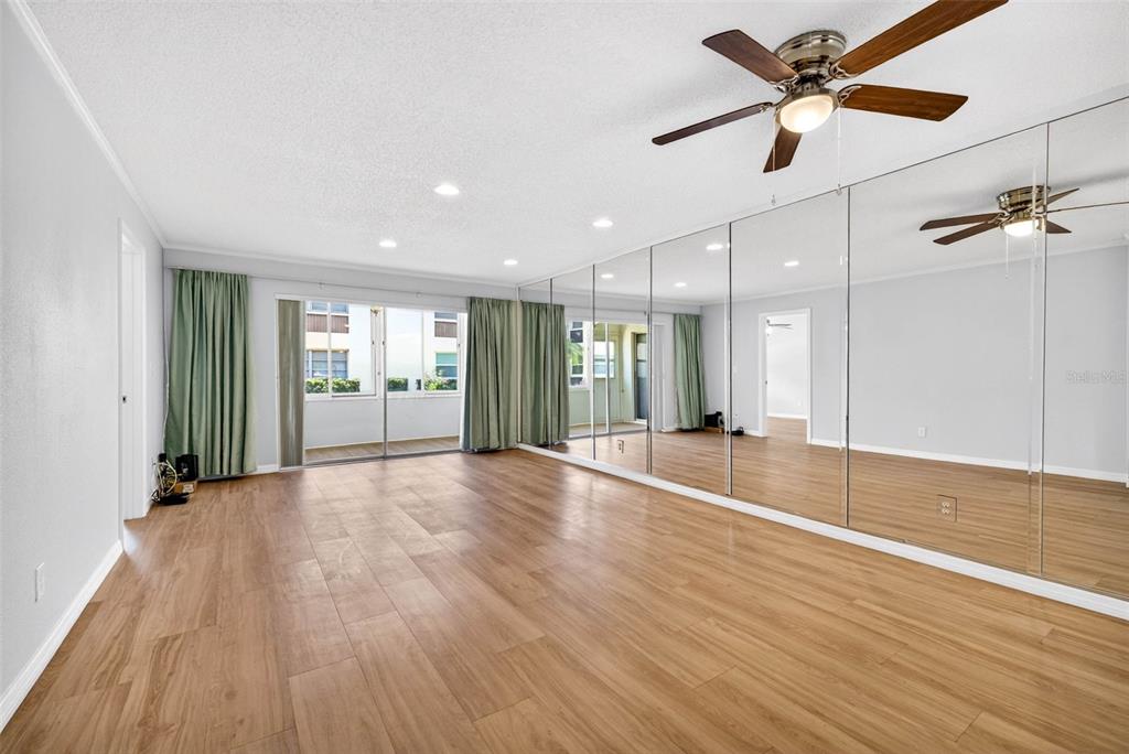 5197 Silent Loop, Unit 124 New Port Richey, FL 34652 - Photo 16 of 55 wooden floor in an empty room with a window