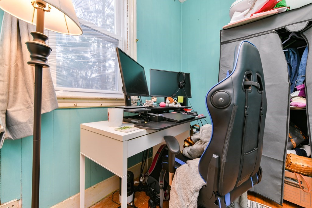 61 Montebello Road Boston, MA 02130 - Photo 11 of 35 a living room with furniture and a flat screen tv