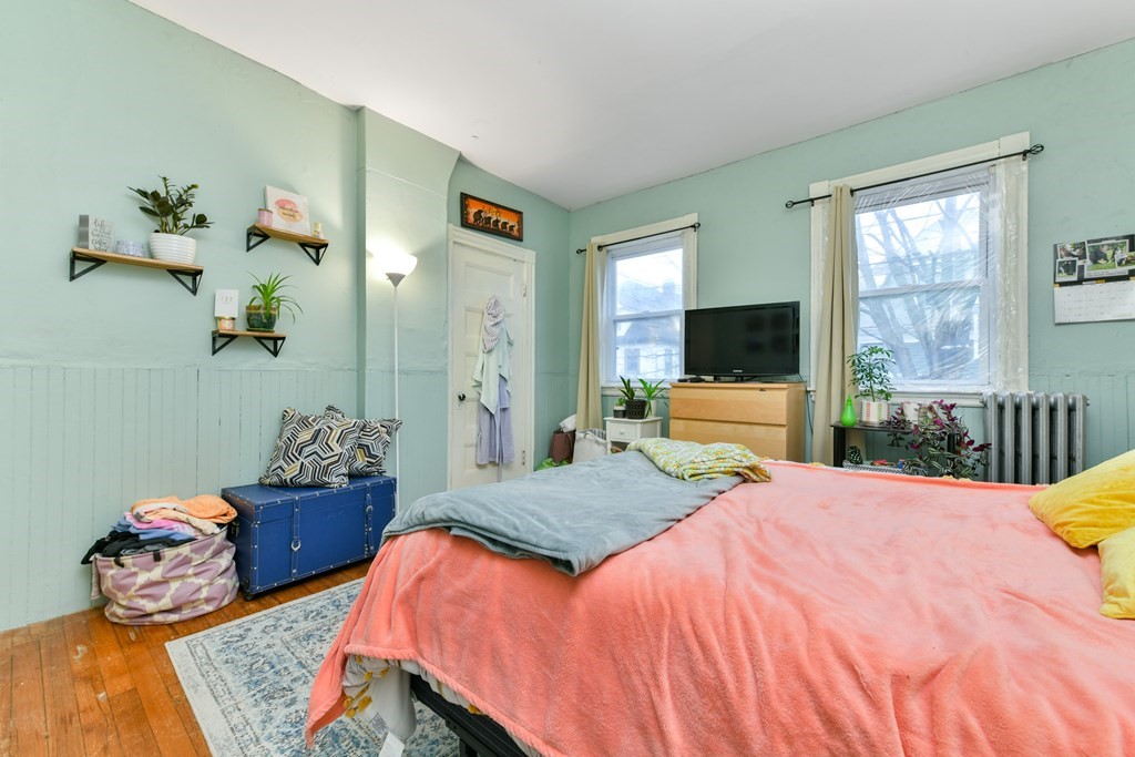 61 Montebello Road Boston, MA 02130 - Photo 12 of 35 a bedroom with two beds and a potted plant