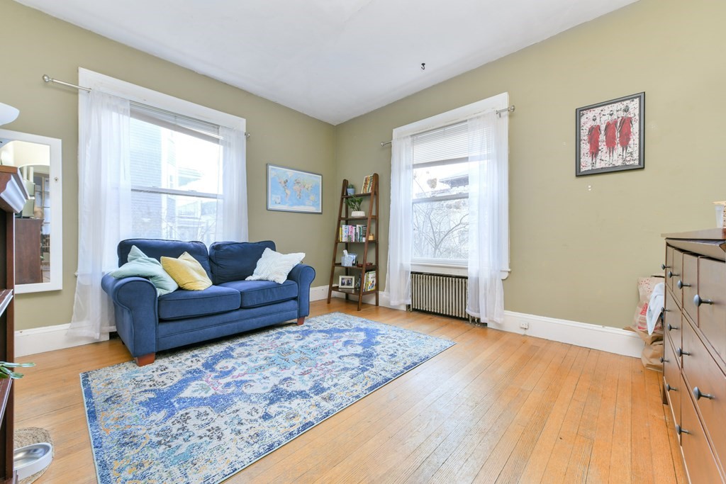 61 Montebello Road Boston, MA 02130 - Photo 15 of 35 a living room with furniture and a fireplace