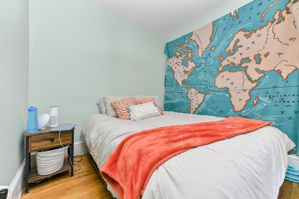 61 Montebello Road Boston, MA 02130 - Photo 16 of 35 a bedroom with a bed and a painting on the wall