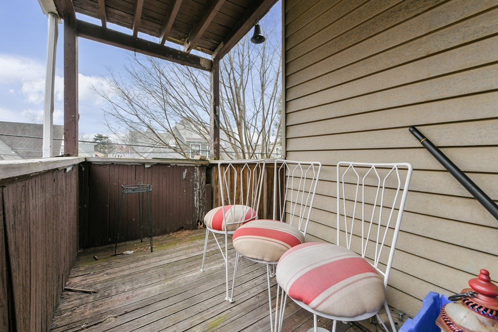 61 Montebello Road Boston, MA 02130 - Photo 21 of 35 a view of a balcony with table and chairs