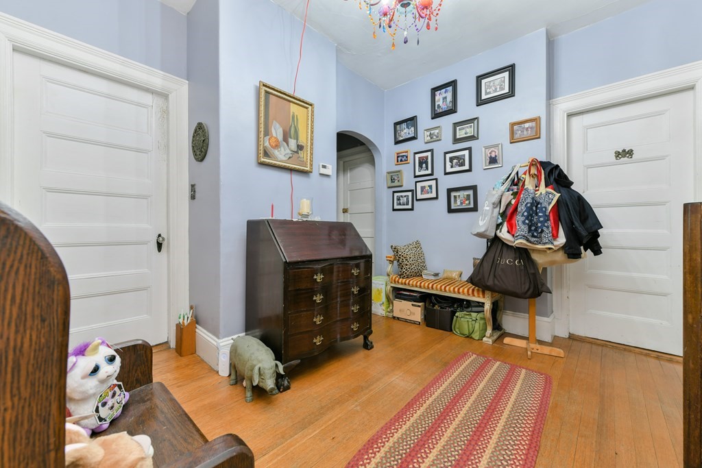 61 Montebello Road Boston, MA 02130 - Photo 22 of 35 a bedroom with a bed and furniture