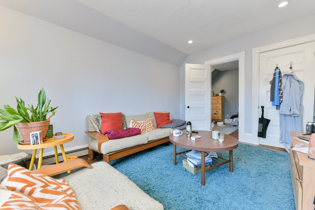 61 Montebello Road Boston, MA 02130 - Photo 24 of 35 a living room with furniture and a rug