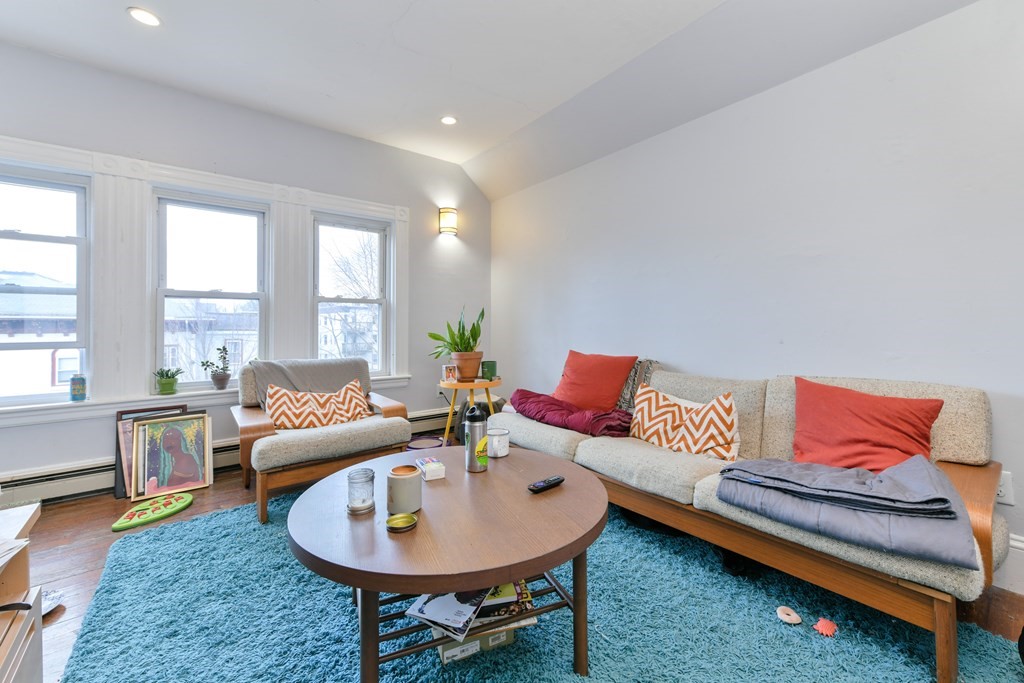 61 Montebello Road Boston, MA 02130 - Photo 25 of 35 a living room with furniture and a wooden floor