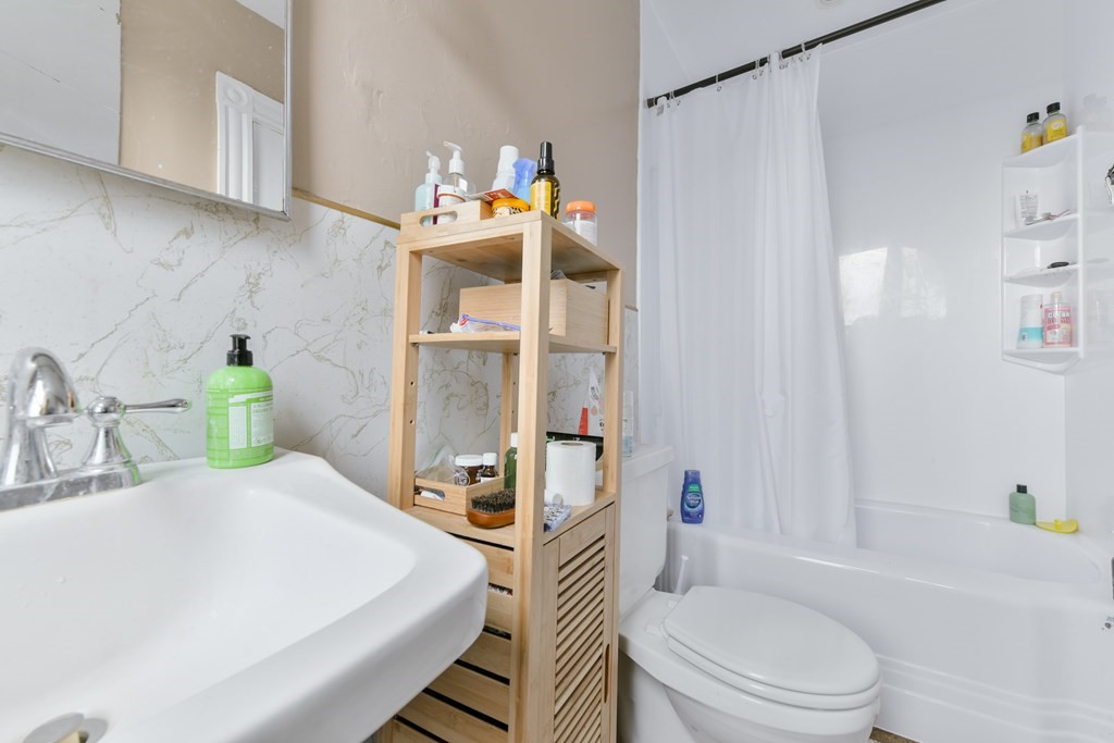 61 Montebello Road Boston, MA 02130 - Photo 27 of 35 a bathroom with a sink toilet and shower