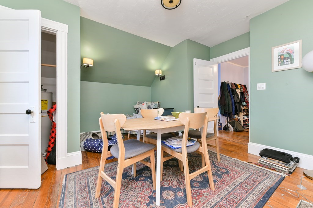 61 Montebello Road Boston, MA 02130 - Photo 29 of 35 a dining room with furniture and wooden floor