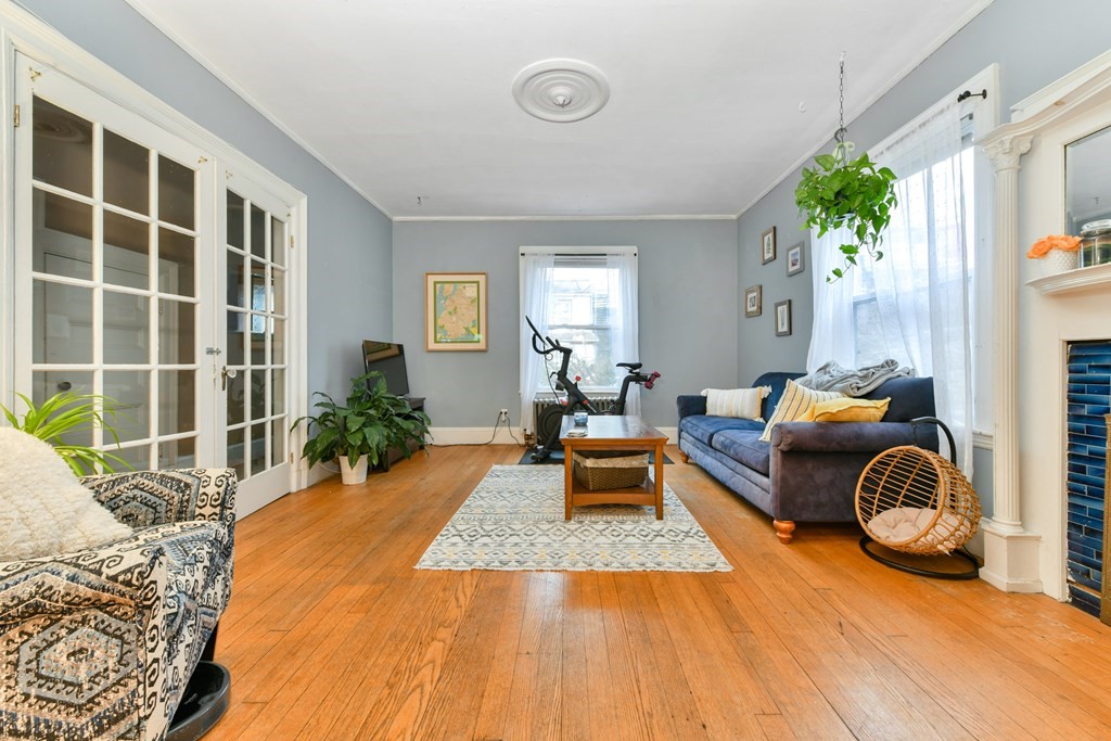 61 Montebello Road Boston, MA 02130 - Photo 5 of 35 a bedroom with furniture and a potted plant