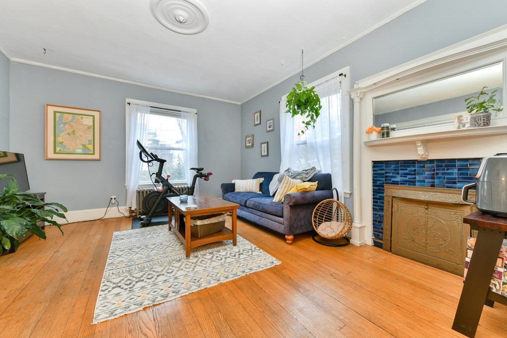 61 Montebello Road Boston, MA 02130 - Photo 6 of 35 a living room with furniture and a fireplace