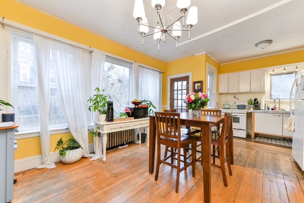 61 Montebello Road Boston, MA 02130 - Photo 7 of 35 a view of a dining room with furniture window and wooden floor