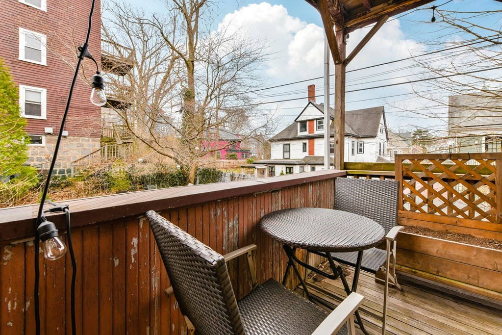 61 Montebello Road Boston, MA 02130 - Photo 10 of 35 a balcony with table and chairs