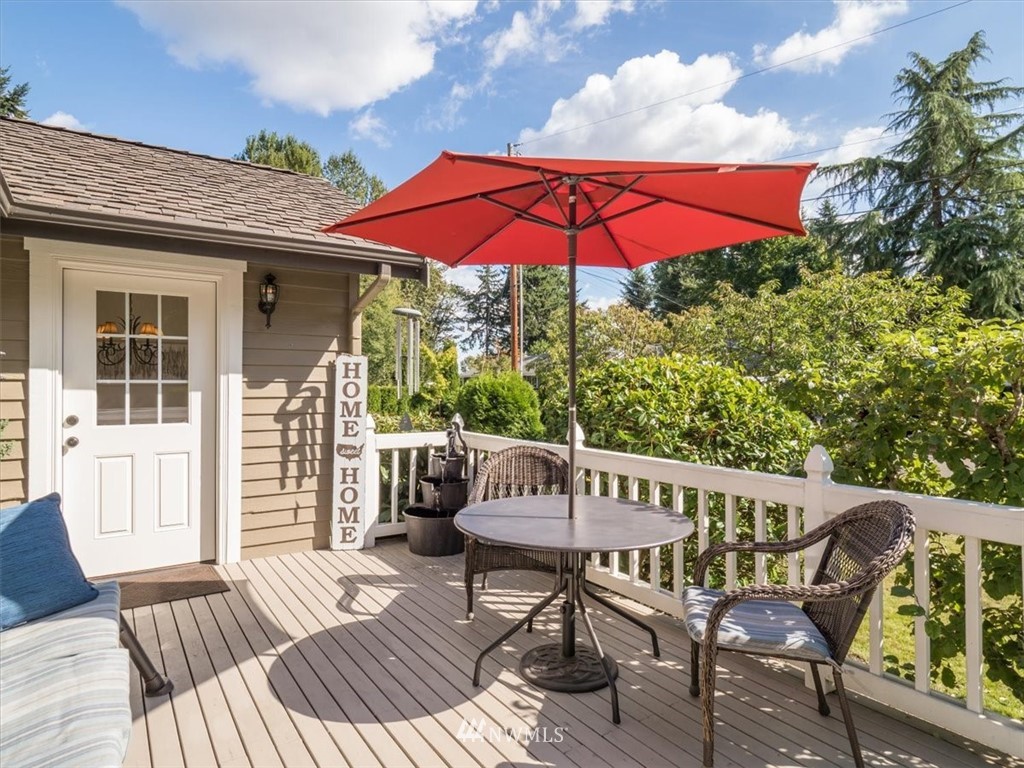 1919 243rd Place Southwest Bothell, WA 98021 - Photo 14 of 39 a view of a deck with furniture and barbeque grill with wooden fence