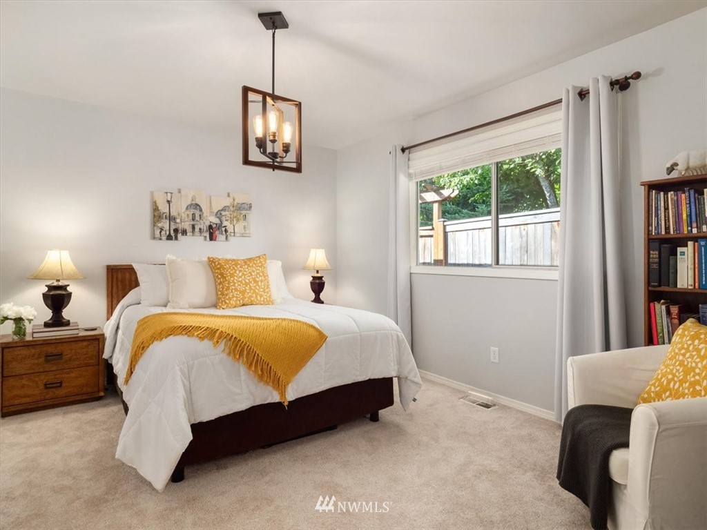 1919 243rd Place Southwest Bothell, WA 98021 - Photo 16 of 39 a bedroom with bed and window