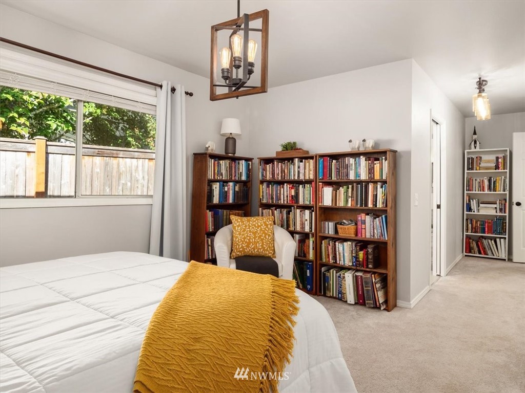 1919 243rd Place Southwest Bothell, WA 98021 - Photo 17 of 39 a bedroom with a bed furniture and a book shelf